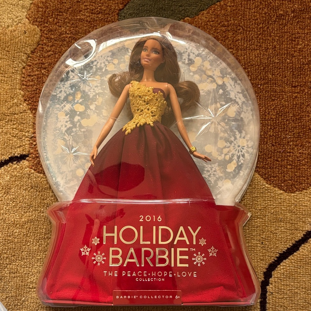 2016 Holiday Barbie Doll collectible in Red and Gold Gown.